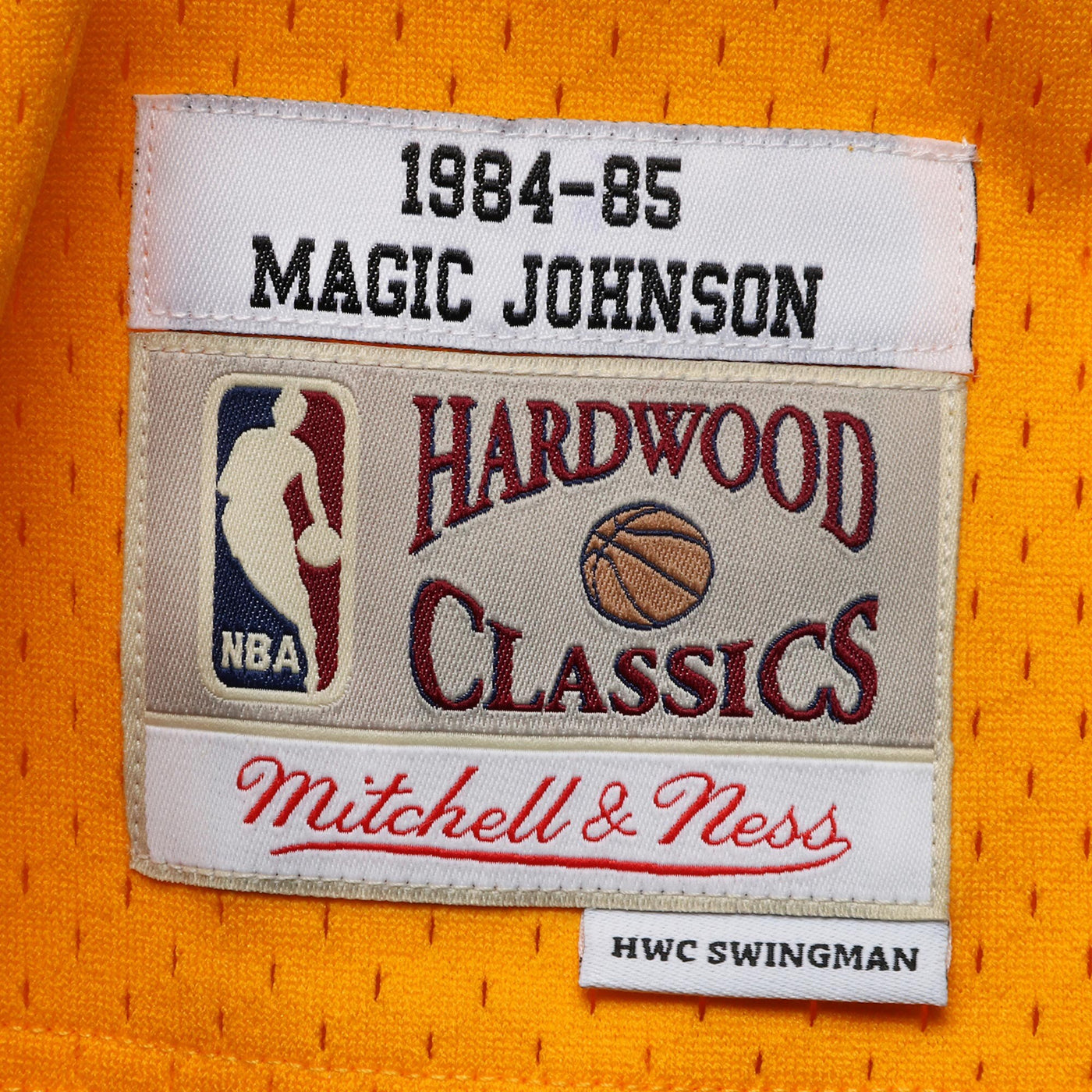 Mitchell & Ness Magic Johnson Gold Los Angeles Lakers 1984-85 Hardwood Classics Swingman Jersey